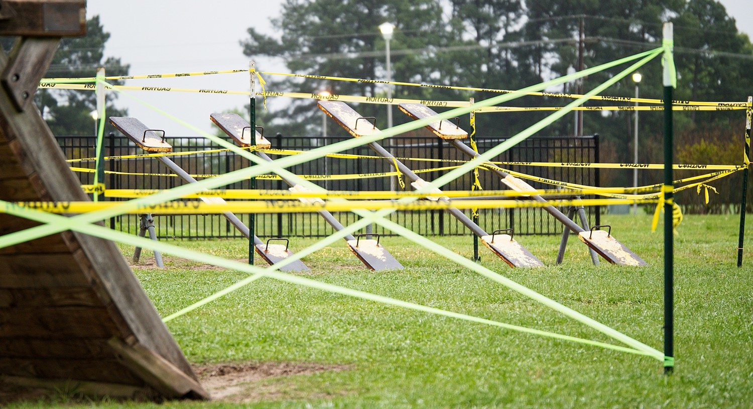 In early April, playground equipment at the Mineola Civic Center was taped off, since early preventative measures focused on coronavirus spread via contact as much as airborne. [you may buy this photo]